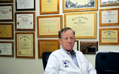 Dr McLeod sitting at a desk